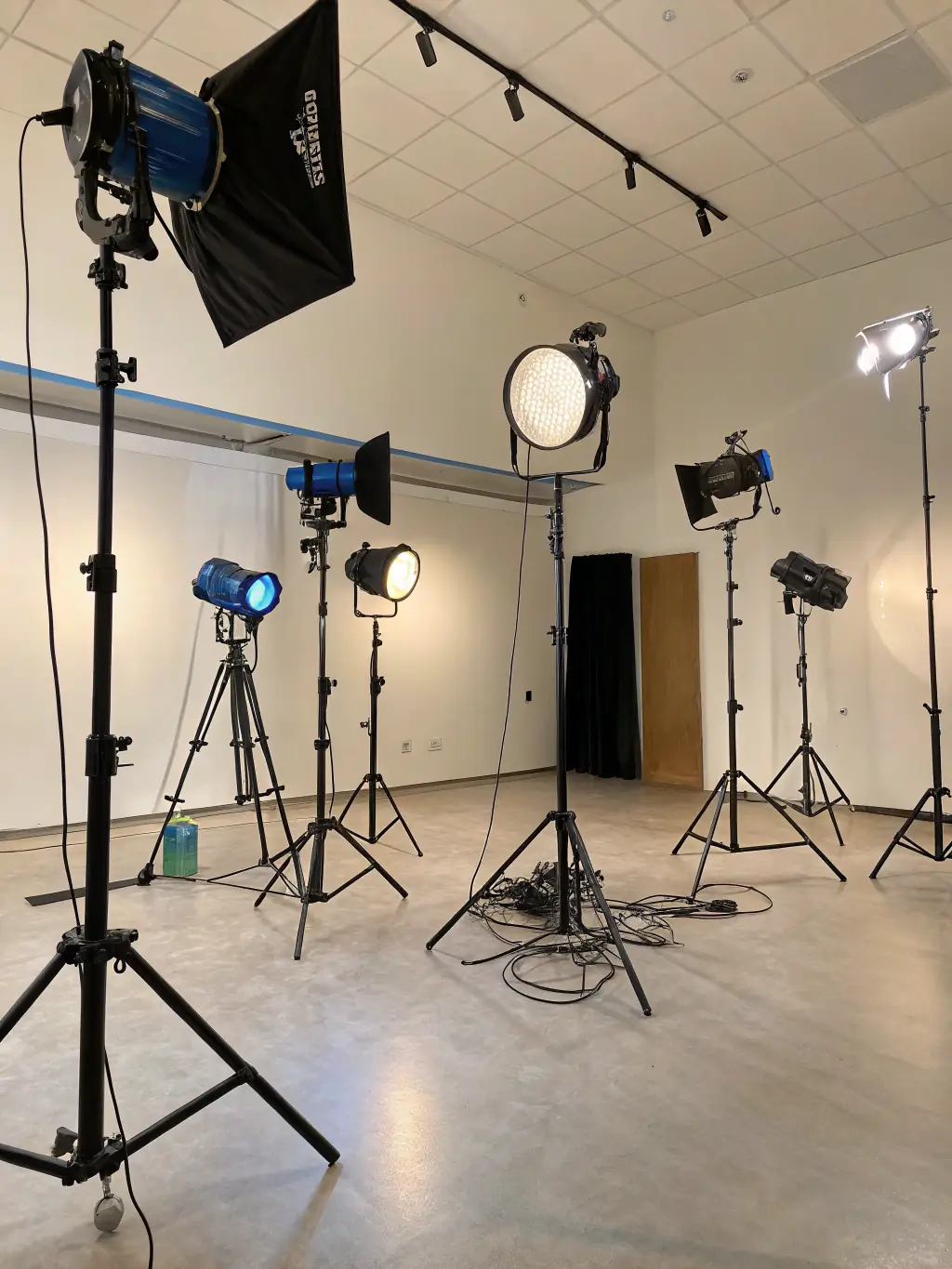 A well-equipped studio with professional lighting and sound equipment, ready for a studio-based filming project, emphasizing the controlled and high-quality environment.